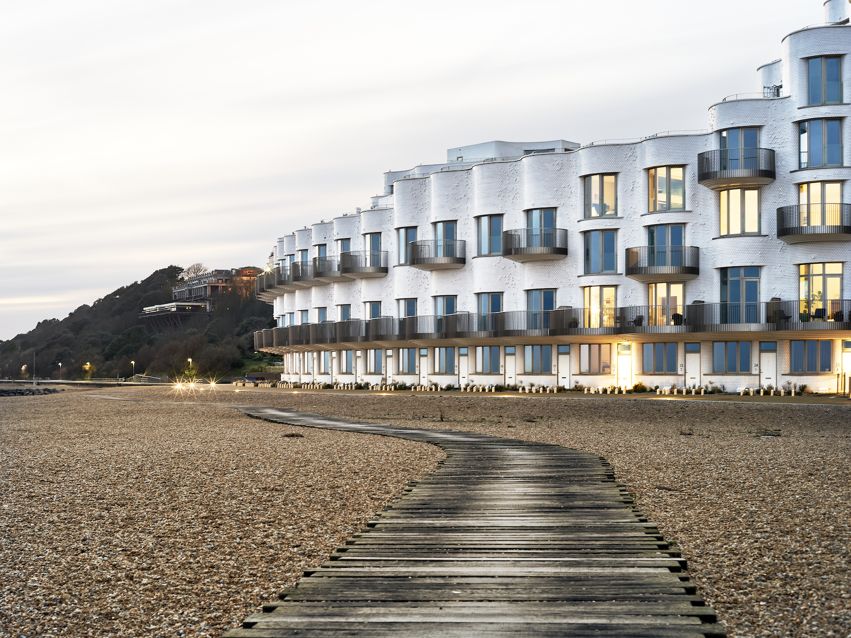 Shoreline coastal residential development by Jenner Contractors at dusk
